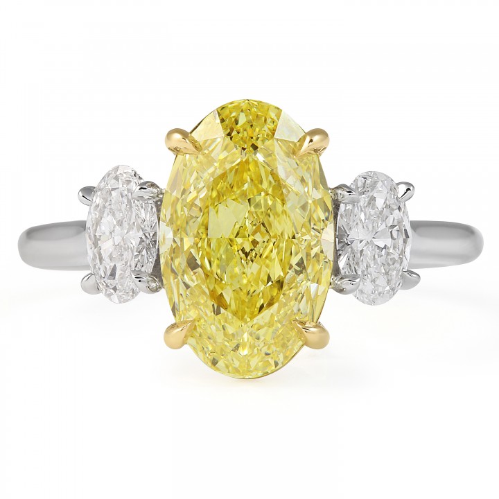 3.01 carat Fancy Intense Yellow Oval Diamond Three-Stone Ring flat