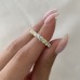 2.2 carat Round Lab Colorless and Yellow Diamond Eternity Band lifestyle pinch