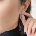 Graduating Emerald Cut Lab Diamond Drop Earrings lifestyle pinch