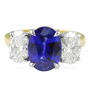 Oval sapphire center with oval diamond side stones