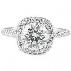 Round diamond in cushion halo engagement ring