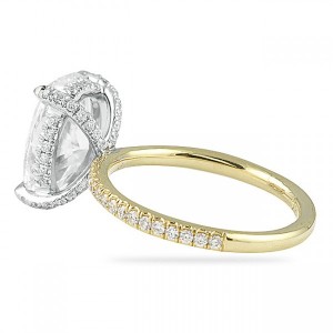 Oval diamond with diamond prongs and yellow gold band