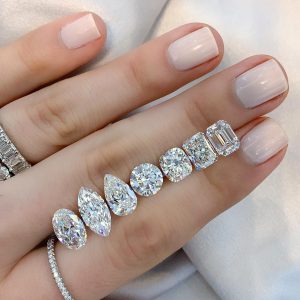 various diamond shapes ladies hand with jewelry